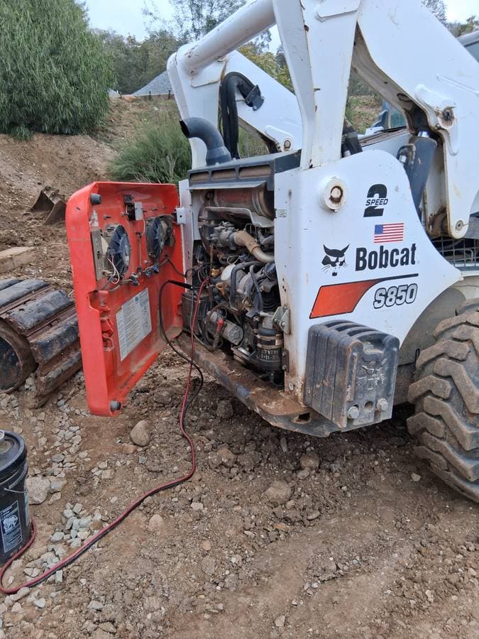 Mobile mechanic performing electrical inspection at customer's home