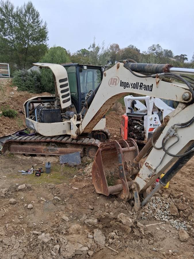 Mobile mechanic performing electrical inspection at customer's home